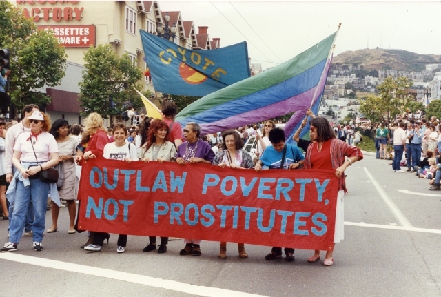 E. Kitch Childs marching with COYOTE for sex workers' rights in 1989 Gay Pride Parade in San Francisco. From left to right holding banner: Gail Pheterson, Norma Jean Almodovar, E. Kitch Childs, Gabriela Silva Leite, Anjara (Tang) Suvarnananda, Margot St. James. Courtesy of Gail Pheterson.